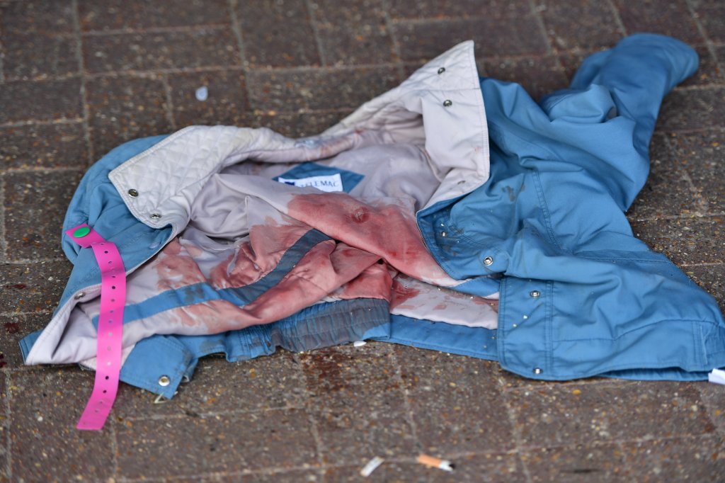  The blood soaked jacket of one of the victims strewn out on the floor outside the police station