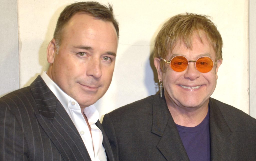 LA couple ... David Furnish and Sir Elton John at a Tom Ford cocktail event in support of Project Angel Food