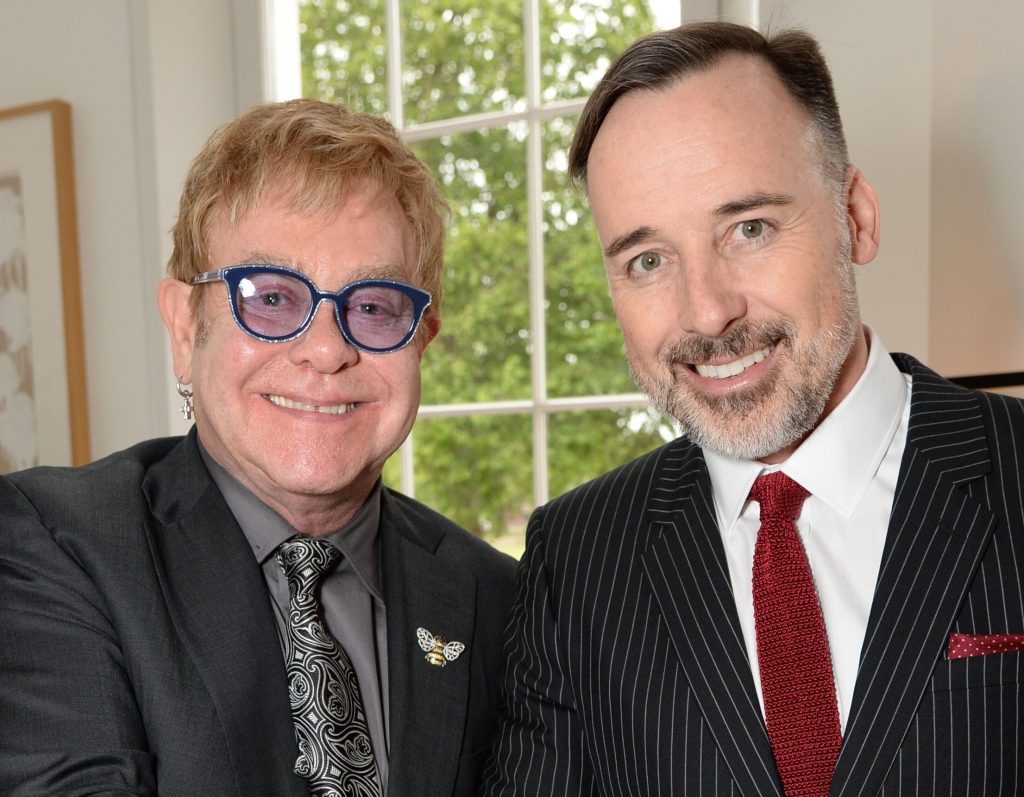 Happy together ... Sir Elton John and David Furnish at The Elton John AIDS Foundation private party