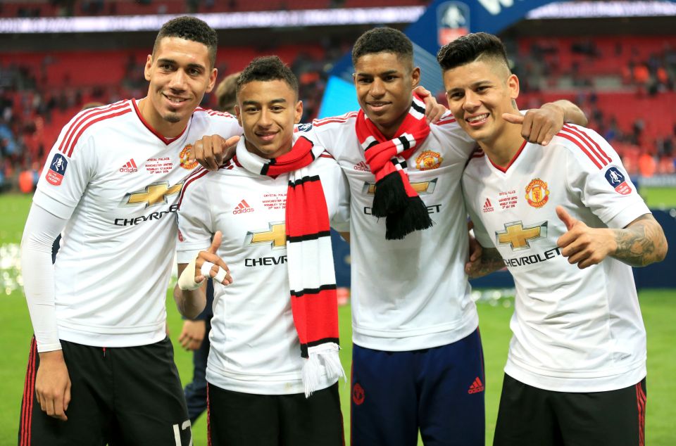 (left to right) Manchester United's Chris Smalling, Jesse Lingard, Marcus Rashford and Marcos Rojo celebrate winning the FA Cup after the Emirates FA Cup Final at Wembley Stadium. PRESS ASSOCIATION Photo. Picture date: Saturday May 21, 2016. See PA story SOCCER Final. Photo credit should read: Mike Egerton/PA Wire. RESTRICTIONS: EDITORIAL USE ONLY No use with unauthorised audio, video, data, fixture lists, club/league logos or "live" services. Online in-match use limited to 75 images, no video emulation. No use in betting, games or single club/league/player publications.