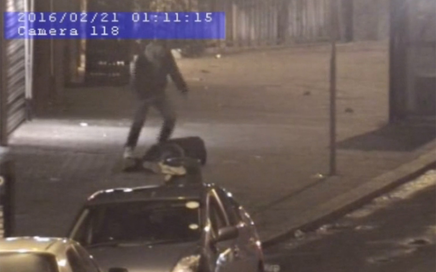  The attacker punches his victim in the back of the head before kicking him on the ground