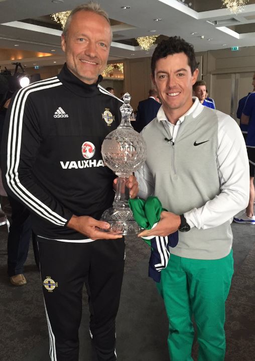  Rory McIlroy poses with his Irish Open trophy alongside Northern Ireland's goalkeeping coach Maik Taylor