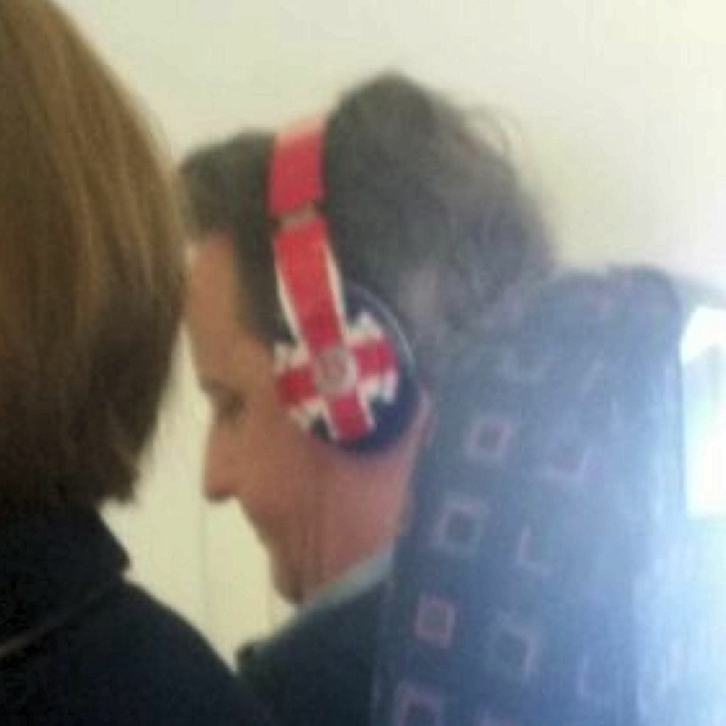  David Cameron was snapped in very patriotic mode relaxing on a flight to Lanzarote