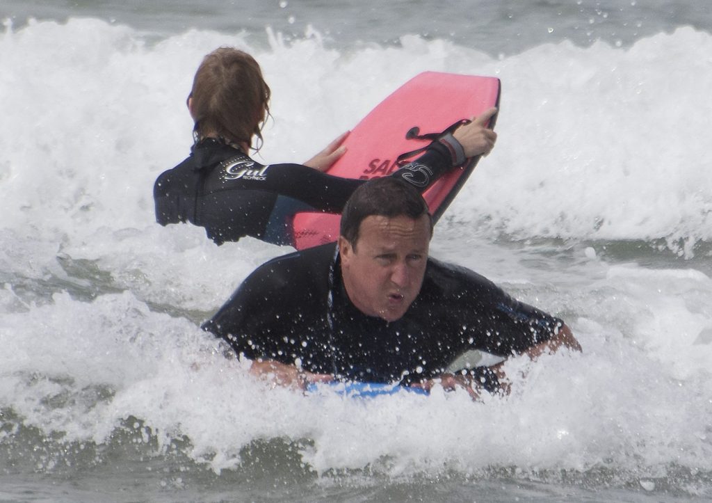  Surf's Up: David Cameron was snapped making a slightly awkward face while bodyboarding on holiday in Cornwall