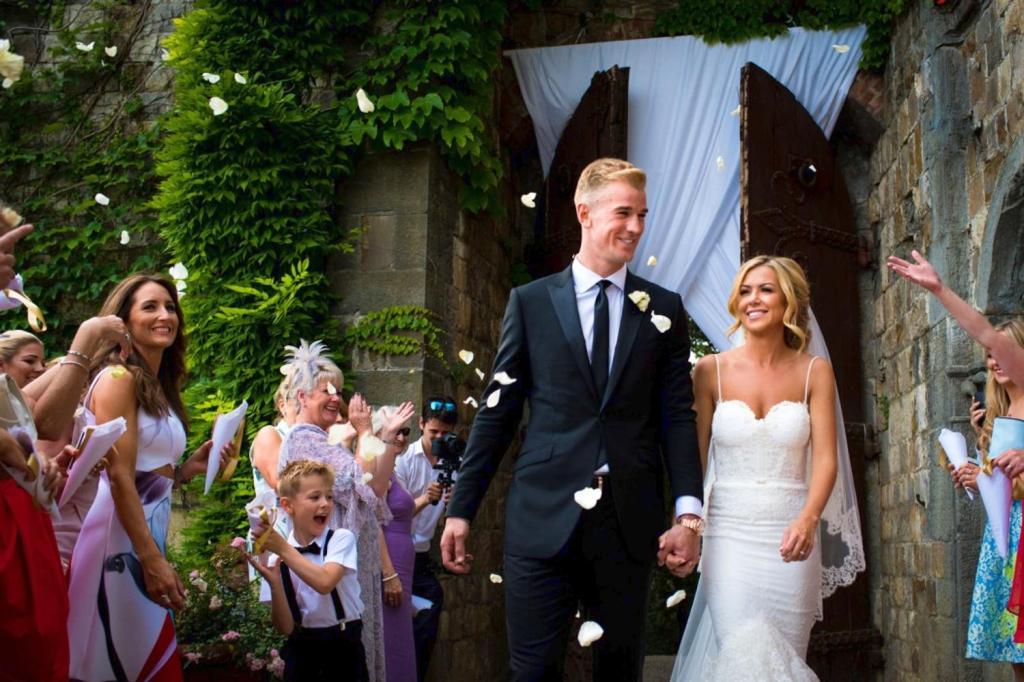 Joe Hart and Kimberly Crew walk hand-in-hand after getting married