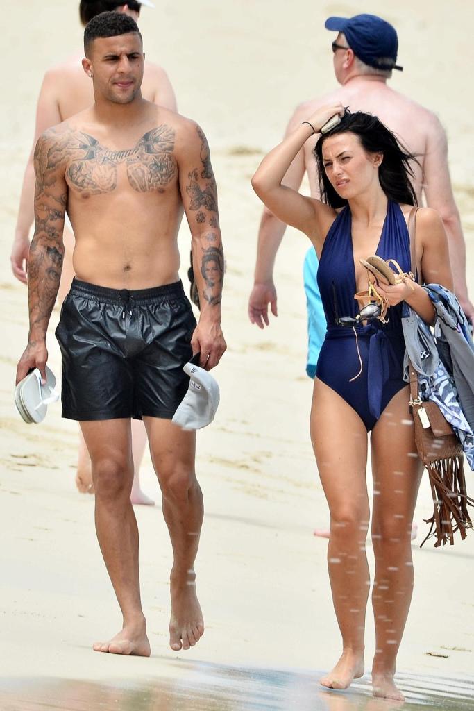 Life's no beach for Kyle Walker as he walks alongside gorgeous Annie Kilner