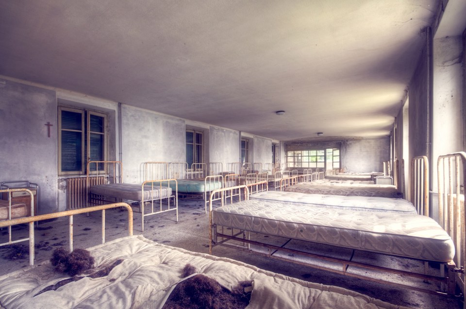  Empty hospital beds at an unknown asylum location