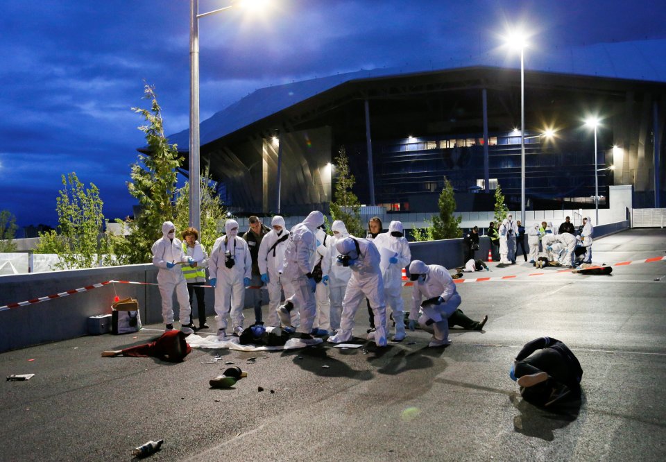  Volunteers play victims of the attack splayed out on the floor