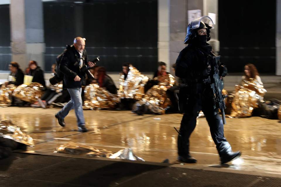  Volunteers wrapped in foil blankets lined the streets of Lyon