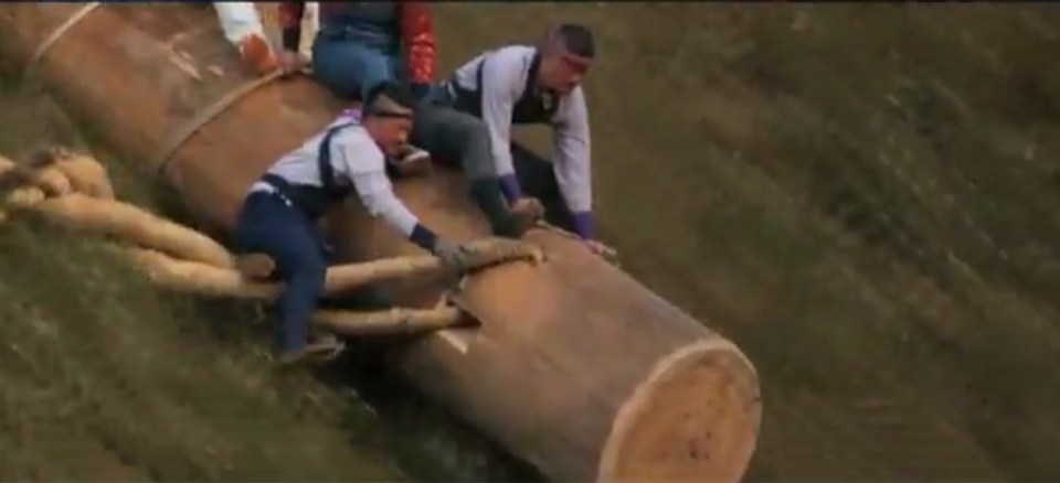  In heart-stopping scenes, men race down steep hills on the logs