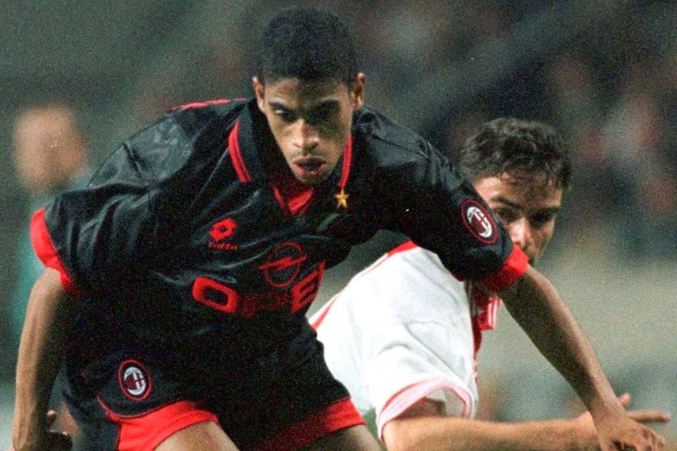 Michael Reiziger in action for AC Milan against Marc Overmars at former club Ajax