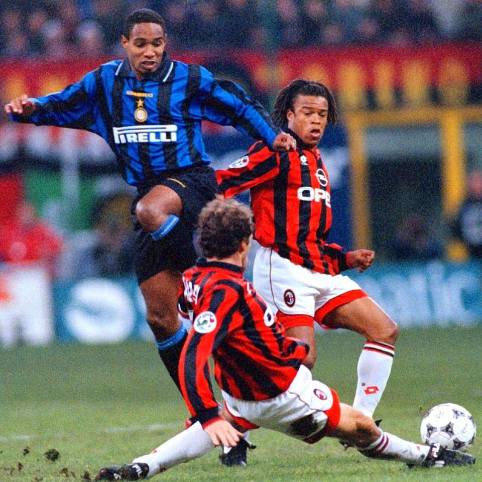 Edgar Davids trieds to hold of Paul Ince, while Franco Baresi puts a tackle in during a Milan derby