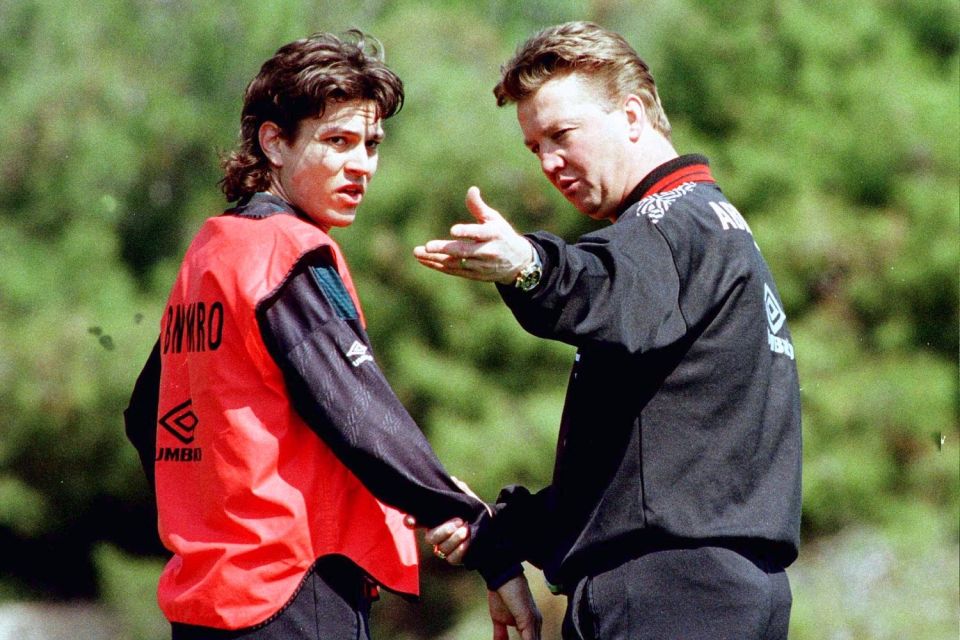 Jari Litmanen is given instructions by Ajax boss Louis van Gaal during an Ajax training session