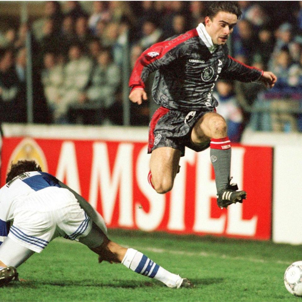 Speedy Marc Overmars leaves an opponent for a dead as he races with the ball whilst playing for Ajax