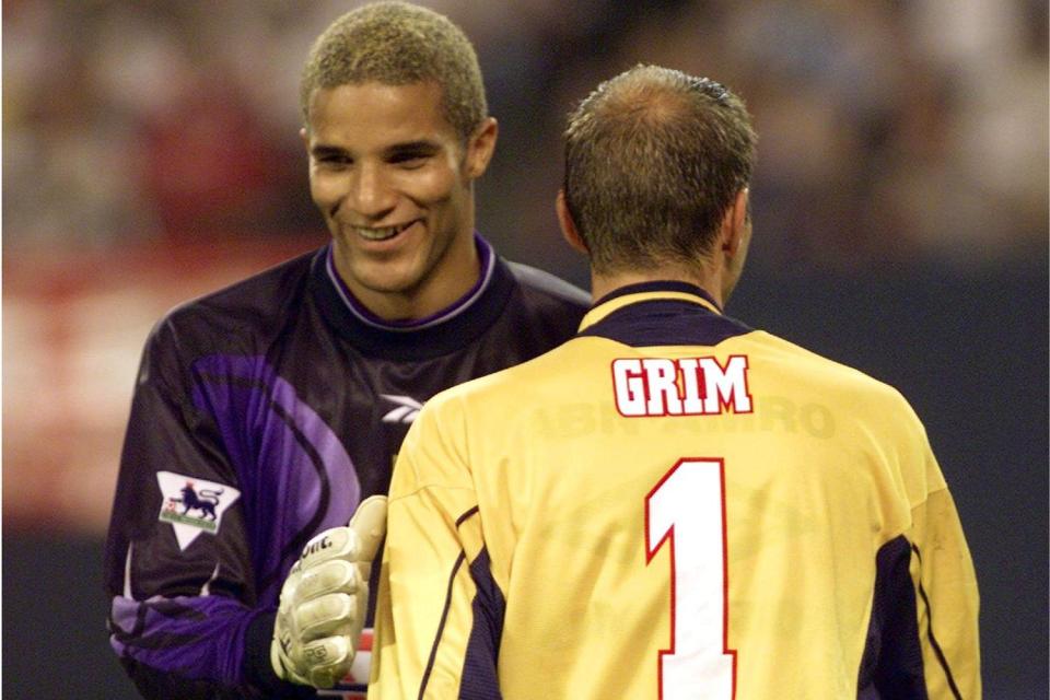 David James shares a joke with Ajax goalkeeper Fred Grim during a friendly