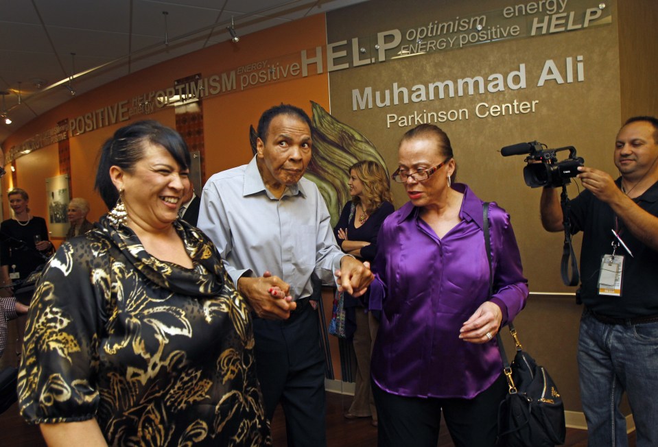 Frail star helped by sister in-law Marilyn Williams and wife Lonnieat the Muhammad Ali Parkinson Center