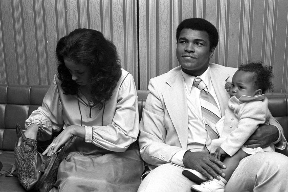 Muhammad Ali with his third wife Veronica Porsche and daughter Hana at Heathrow airport in 1977