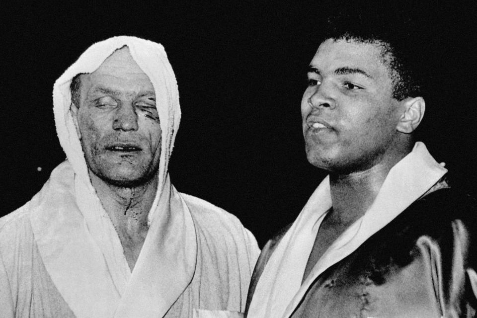 Muhammad Ali twice defeated Henry Cooper but was famously knocked down by Brit