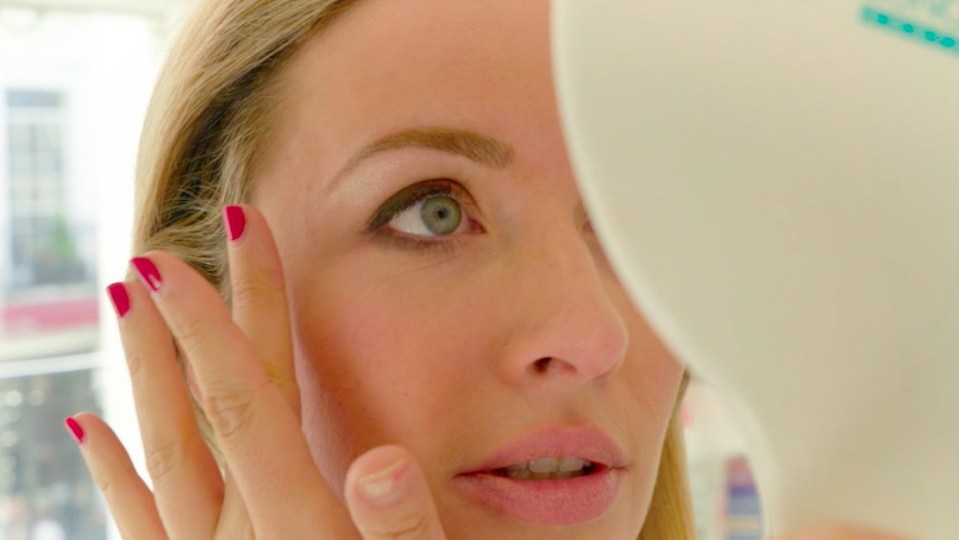 Lauren admires her new perfect eyebrows in the mirror