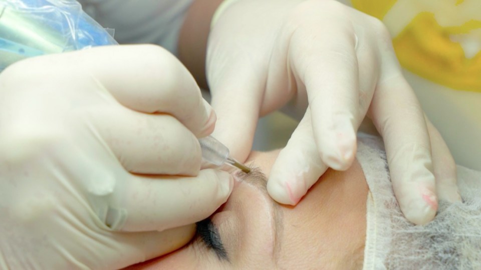 Tracie uses a nano needle to draw on each hair