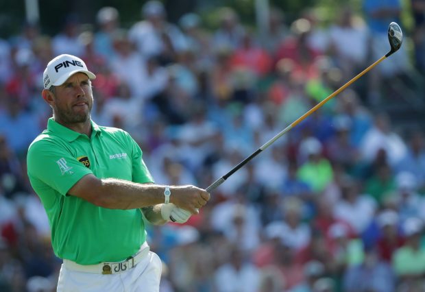 England golfer Westwood tries to repair the damage on the 10th tee but it is too late