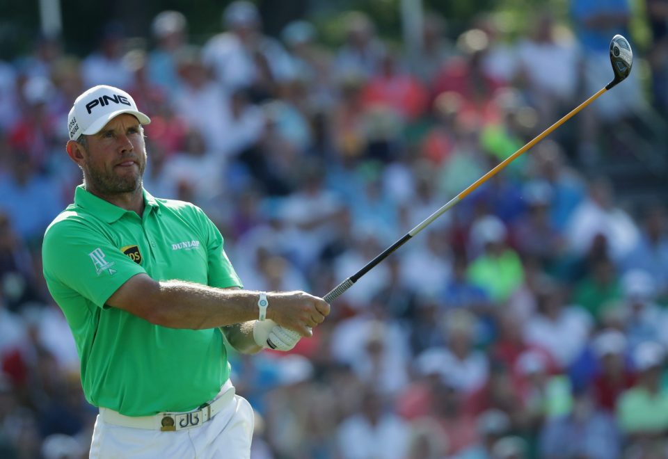  England golfer Westwood tries to repair the damage on the 10th tee but it is too late