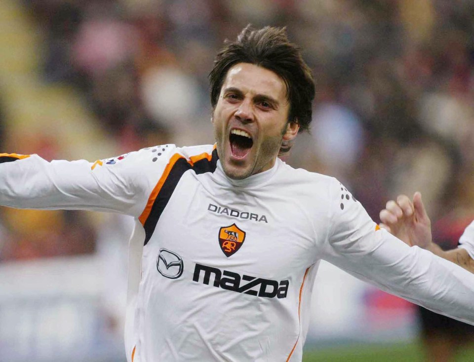  Vincenzo Montella celebrates a goal for Roma against AC Milan