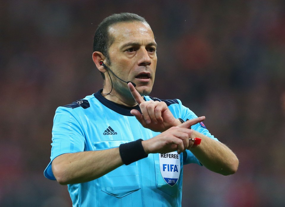 MUNICH, GERMANY - MAY 03: Referee Cuneyt Cakir signals during UEFA Champions League semi final second leg match between FC Bayern Muenchen and Club Atletico de Madrid at Allianz Arena on May 3, 2016 in Munich, Germany. (Photo by Alexander Hassenstein/Bongarts/Getty Images)