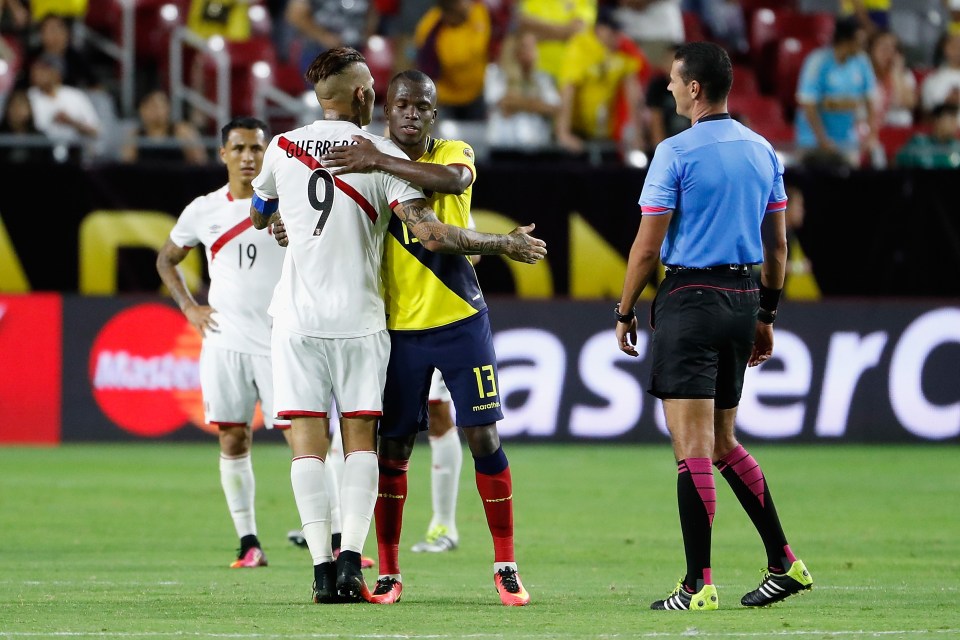 Players from both sides embrace after Peru and Ecuador drew 2-2 in Arizona