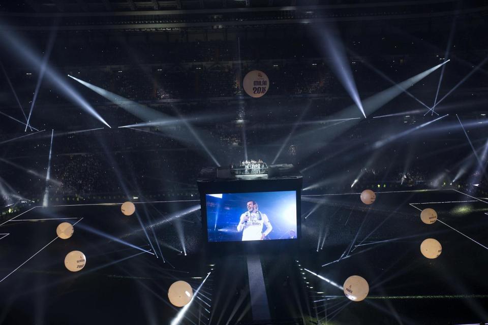 Real forward Bale speaks to fans on the big screen after the Champions League final