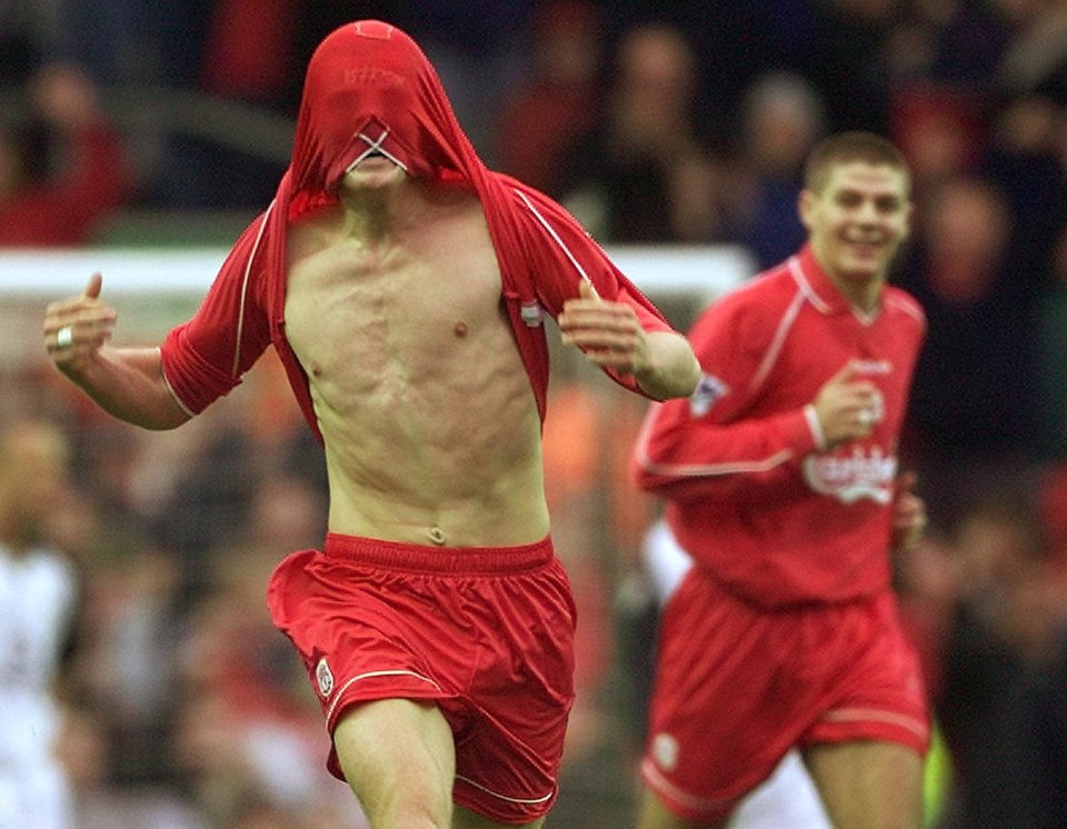 Riise celebrates smashing in a free-kick against Manchester United