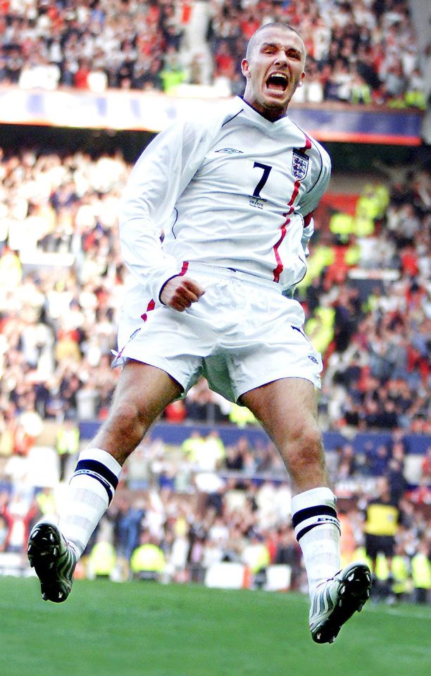  Jumping for joy...David Beckham celebrates his wonder goal against Greece