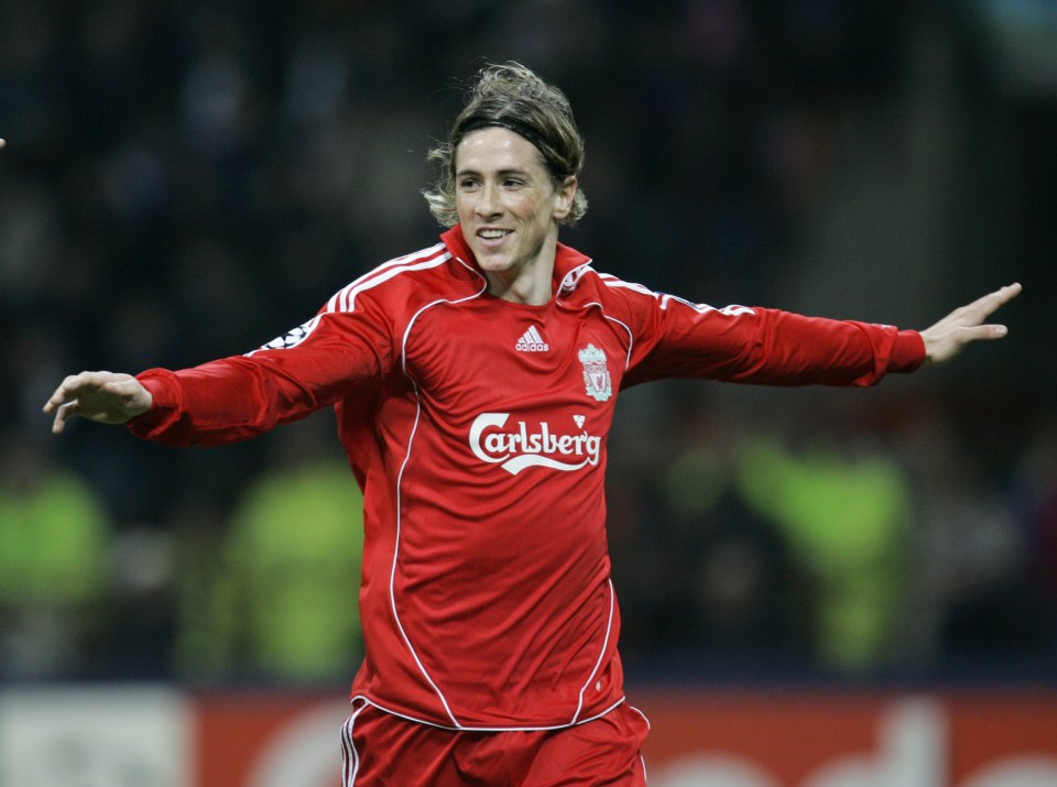 Liverpool forward Fernando Torres, of Spain, cheers after scoring, during a Champions League, round of 16 return-leg soccer match between Inter Milan and Liverpool, at the San Siro stadium in Milan, Italy, Tuesday, March 11, 2008. (AP Photo/Antonio Calanni)