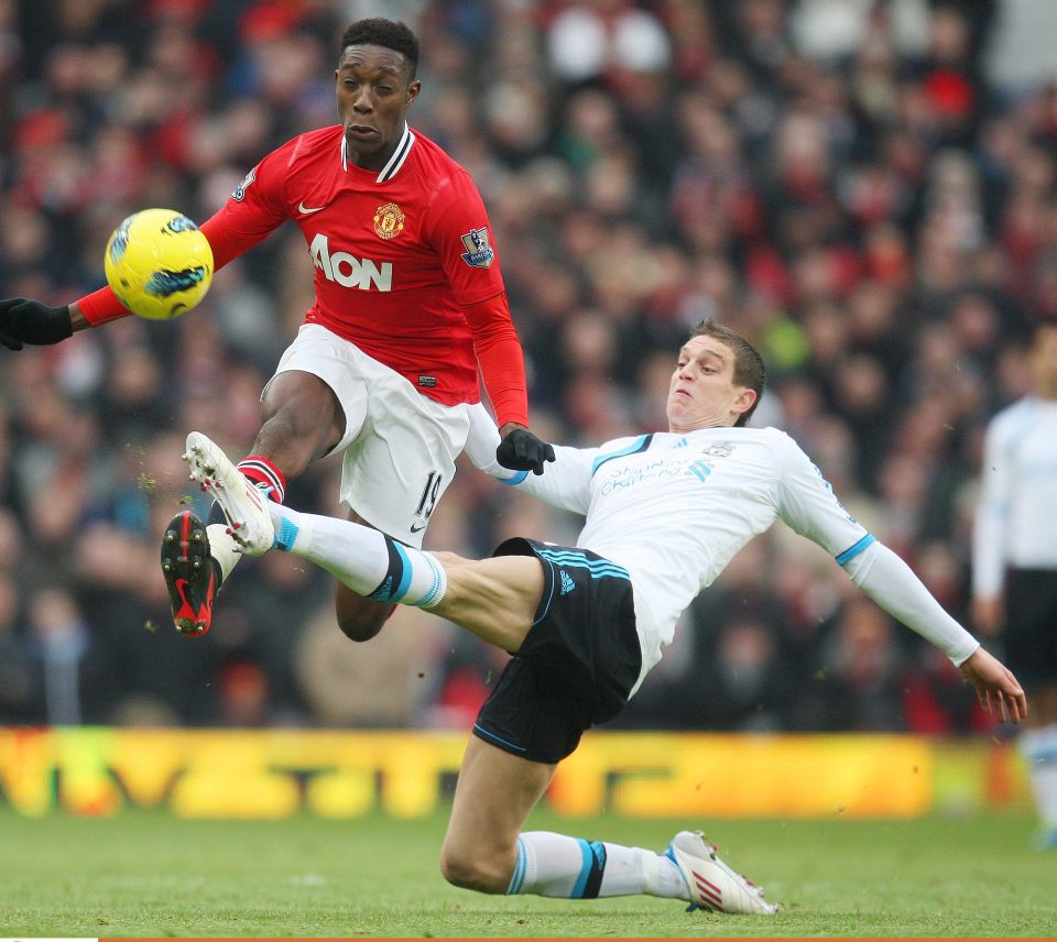  Agger tussles with Danny Welbeck in many a battle with Manchester United