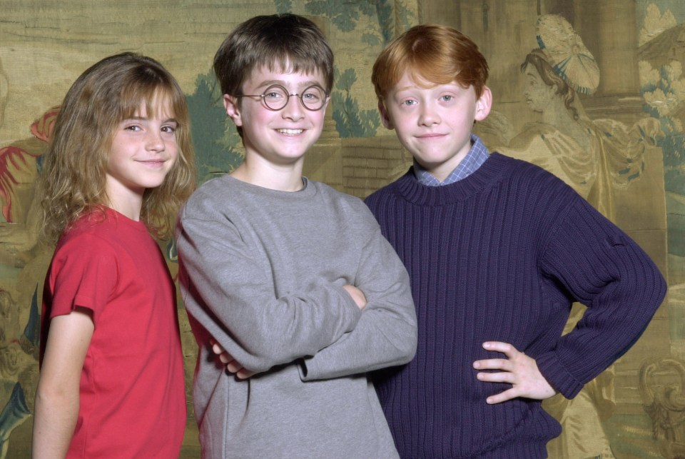 376506 01: Warner Bros. Pictures announced August 21, 2000 that the young actor Daniel Radcliffe, center, has been named as the young actor who will play Harry Potter, in the upcoming film adaptation of the popular books by J.K. Rowling. Newcomers Rupert Grint, right, and Emma Watson will be taking on the roles of Ron and Hermione, Harry's best friends at Hogwarts. (Courtesy of Warner Bros./Newsmakers)