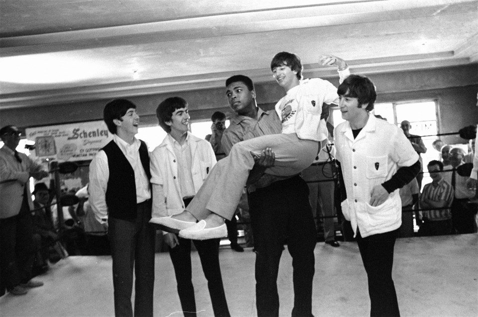  Larking around . . . Ali lifts Ringo Starr in the air in the ring