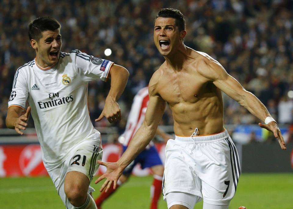 Real Madrid's Cristiano Ronaldo (R) celebrates with team mate Alvaro Morata (L) after scoring a penalty against Atletico Madrid during their Champions League final soccer match at the Luz Stadium in Lisbon May 24, 2014. REUTERS/Kai Pfaffenbach (PORTUGAL - Tags: SPORT SOCCER TPX IMAGES OF THE DAY)