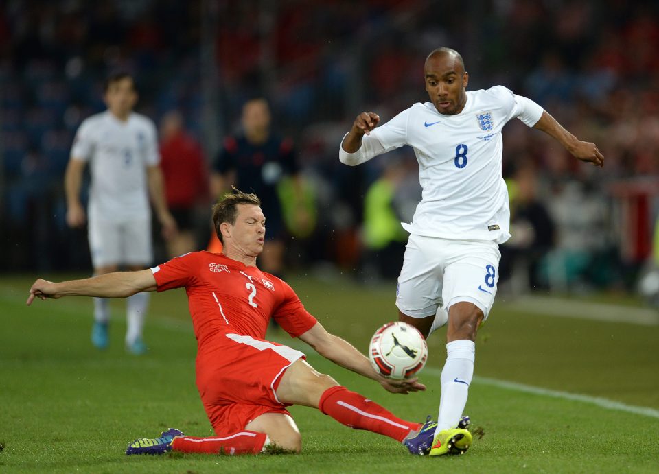 Stephan Lichtsteiner tackles Fabian Delph as England played Switzerland at Wembley