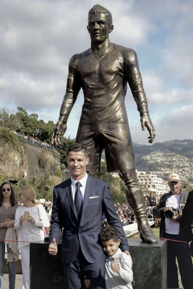 Cristiano Ronaldo with his son, Cristiano Jr, during the unveiling of his statue in his home-town of Funchal in Portugal