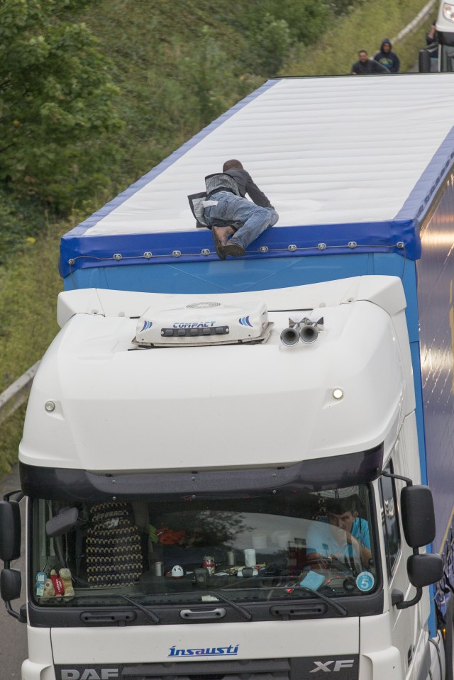 Migrants in Calais trying to get into UK bound lorries.