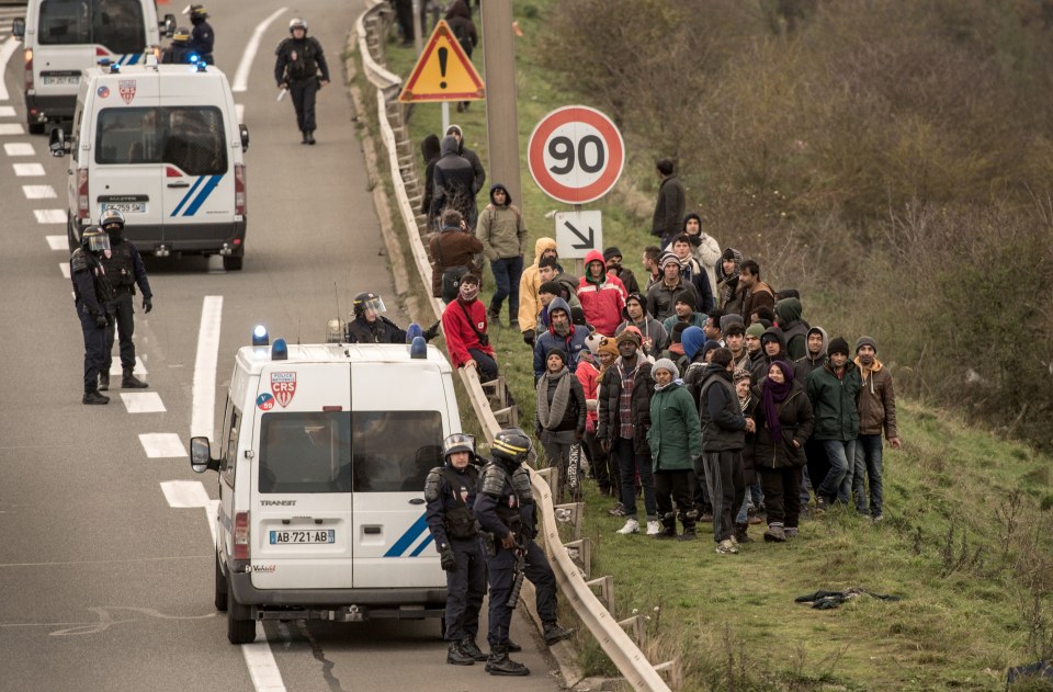 French riot police block migrants and re