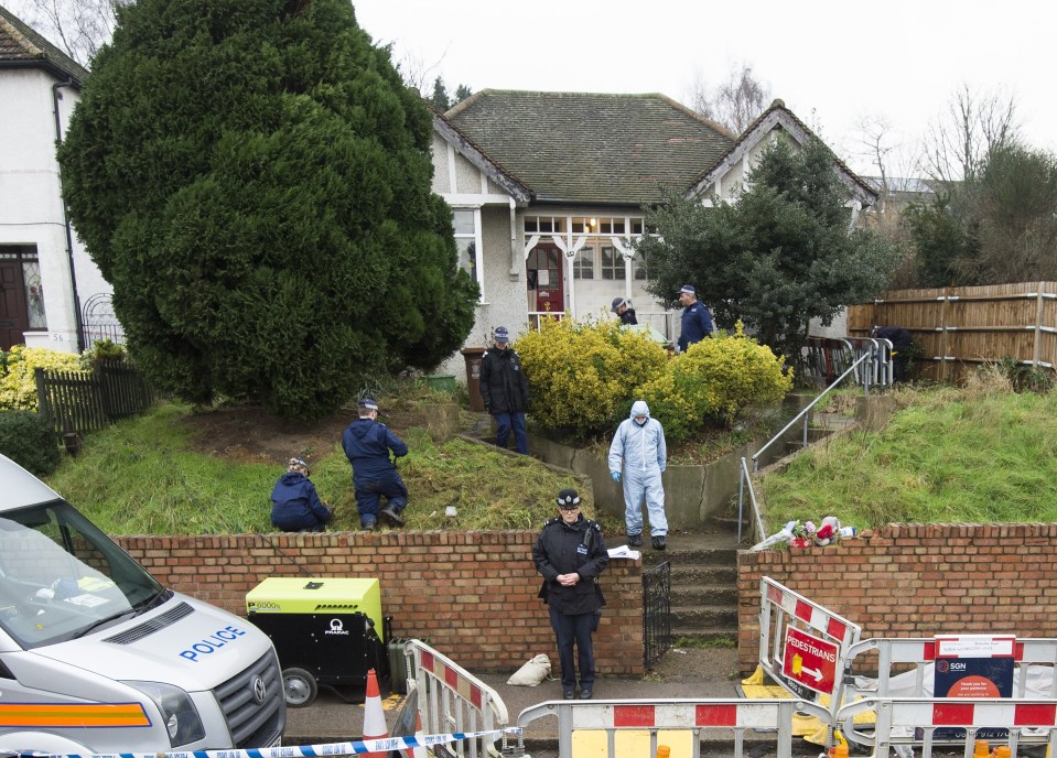  Police and forensic officers search the home of former Eastenders star Sian Blake after her she was found dead along with her two children