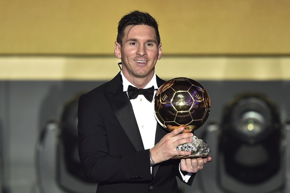  Lionel Messi holds the Ballon d'Or trophy, which he has won a record five times