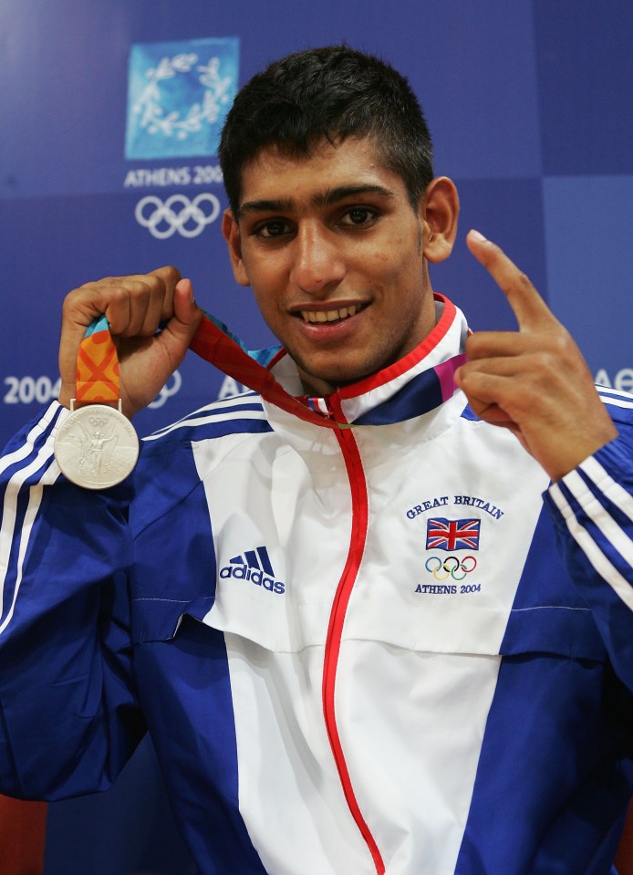 ATHENS - AUGUST 29: Amir Khan of Great Britain poses with his bronze medal for the men's boxing 60 kg event on August 29, 2004 during the Athens 2004 Summer Olympic Games at Peristeri Olympic Boxing Hall in Athens, Greece. (Photo by Getty Images)