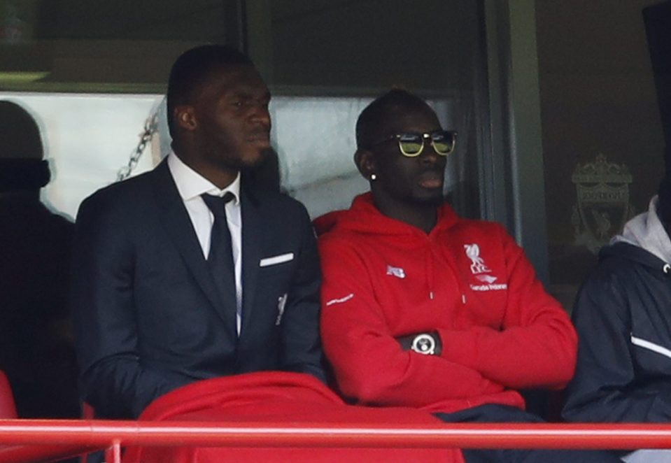  Sitting it out...Sakho joins teammate Christian Benteke in the stands after the decision was taken for him not to play for Liverpool in final matches of the season