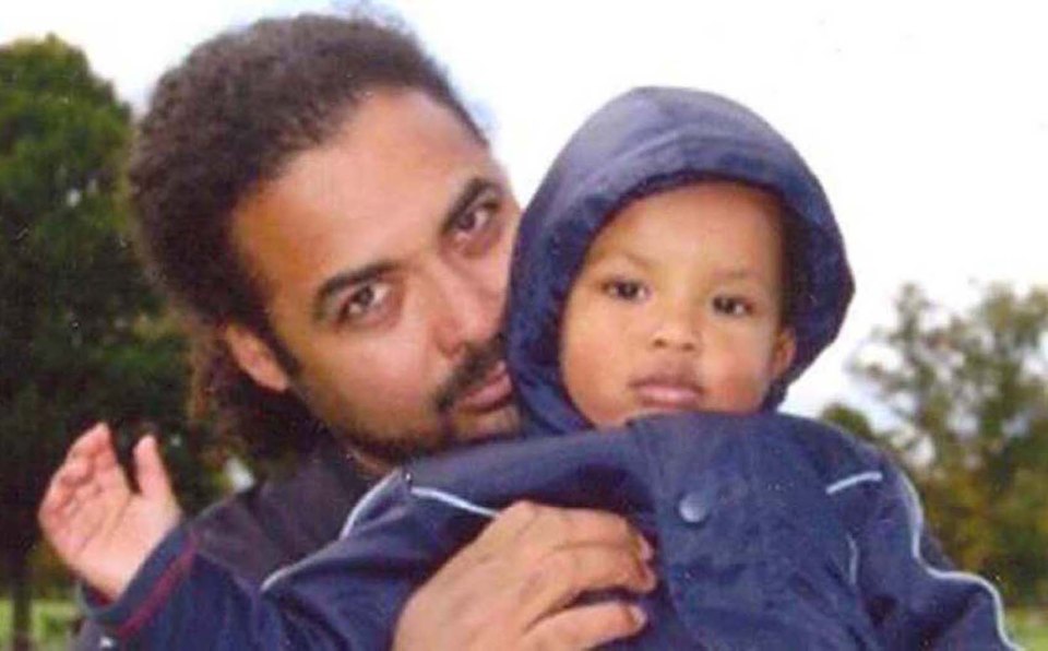  The killer pictured with his son Amon. He appeared in court via video link today to admit three counts of murder