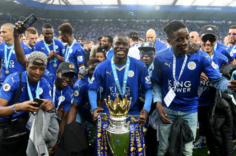  Kante celebrates with the Premier League trophy after Foxes title success