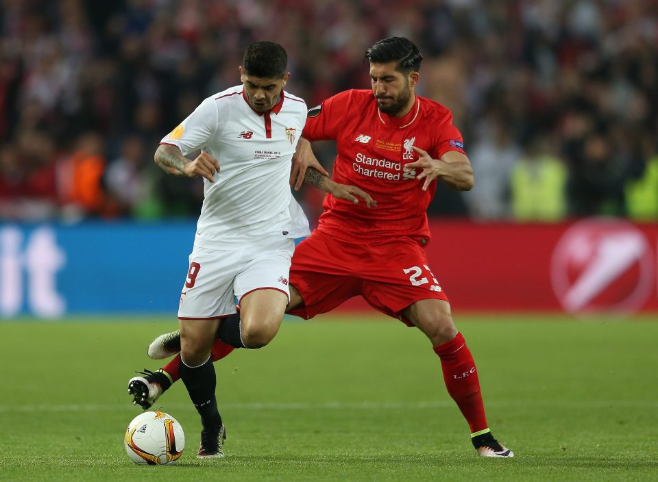  Ever Banega takes on Emre Can during Sevilla Europa League win over Liverpool