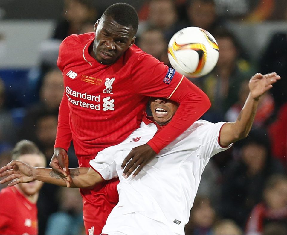  Benteke and Sevilla's Mariano Ferreira tussle during the Europa League final