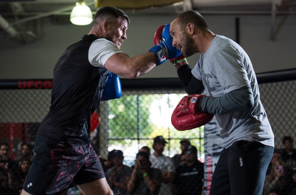  Winning team: Bisping works out for the fans with coach Jason Parillo